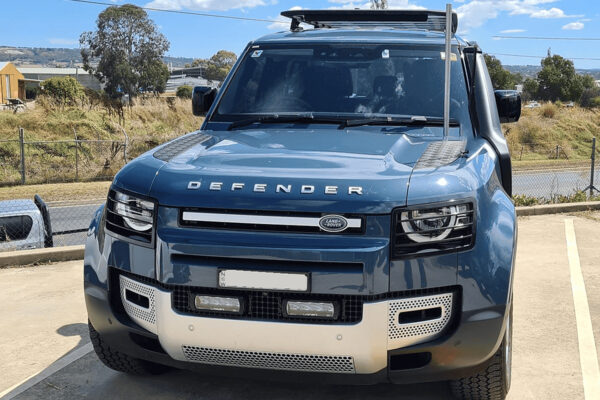 This gives the vehicle a bold all-white look that we’re more used to seeing from a boat than an automobile. The finish is also coated in the same metal lacquer used on bulldozers to help fight off unsightly scratches and scuffs. Completing the exterior package are white British heritage wheels based on those found on the original Land Rover.